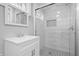 Updated bathroom features new vanity, tiled shower with glass door, and tiled flooring at 2920 E 11Th St, Indianapolis, IN 46201