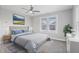Serene bedroom with a large bed, stylish decor, and a bright window with a neighborhood view at 2920 E 11Th St, Indianapolis, IN 46201