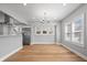 Bright dining area with hardwood floors, modern lighting, and adjacent kitchen for easy entertaining at 2920 E 11Th St, Indianapolis, IN 46201