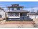 Charming two-story home featuring a modern design, landscaped yard, and a detached three-car garage at 2920 E 11Th St, Indianapolis, IN 46201