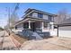 Beautiful two-story home with inviting front porch, attractive landscaping, and a private driveway with three-car garage at 2920 E 11Th St, Indianapolis, IN 46201
