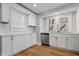 Well-lit kitchen featuring stainless steel appliances, sleek white cabinetry and decorative tile backsplash at 2920 E 11Th St, Indianapolis, IN 46201