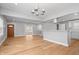 Open-concept living area showcasing hardwood floors, modern lighting, and a seamless transition to the kitchen at 2920 E 11Th St, Indianapolis, IN 46201