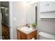 Cozy bathroom with a single sink vanity and updated fixtures at 3168 Lodgepole Dr, Whiteland, IN 46184
