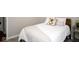Bedroom featuring a white comforter, decorative pillow, and bedside table at 3168 Lodgepole Dr, Whiteland, IN 46184