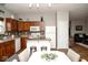 Kitchen area featuring an island with seating, appliances, cabinets, and open access to other rooms at 3168 Lodgepole Dr, Whiteland, IN 46184