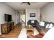 Comfortable living room with stylish furnishings, a large TV, and open to the entry way at 3168 Lodgepole Dr, Whiteland, IN 46184