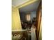 Cluttered bedroom with miscellaneous items strewn about and light streaming in from a window at 326 N Grant St, Brownsburg, IN 46112