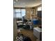 Untidy living room with outdated furniture, clutter, and worn carpeting at 326 N Grant St, Brownsburg, IN 46112