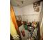 Small room filled with debris, paint cans, and discarded items; in need of renovation at 326 N Grant St, Brownsburg, IN 46112