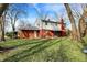 Home with large backyard, patio, red brick, and white siding at 333 E Waterbury Rd, Indianapolis, IN 46227