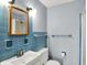 The bathroom features a white sink, tile, and a wood-framed mirror at 333 E Waterbury Rd, Indianapolis, IN 46227