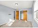 Bright bedroom with neutral carpet, walk-in closet, and a sun-filled window providing a warm and inviting space at 333 E Waterbury Rd, Indianapolis, IN 46227