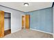Charming bedroom with blue accent wall, neutral carpet, and closets adding a touch of personality and functionality at 333 E Waterbury Rd, Indianapolis, IN 46227