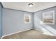 Comfortable bedroom with carpet, light blue walls and bright windows offering natural light and pleasant views at 333 E Waterbury Rd, Indianapolis, IN 46227