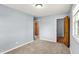 Empty bedroom with multiple doorways and neutral colored carpet at 333 E Waterbury Rd, Indianapolis, IN 46227