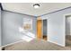 Cozy bedroom featuring neutral carpet, a window, and a closet creating a simple yet functional living space at 333 E Waterbury Rd, Indianapolis, IN 46227
