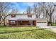 Inviting two-story home featuring a brick facade, white siding, and a two-car garage at 333 E Waterbury Rd, Indianapolis, IN 46227