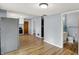 View of the kitchen leading to the bathroom and featuring vinyl floors and grey walls at 333 E Waterbury Rd, Indianapolis, IN 46227