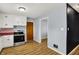 Well-lit kitchen with white cabinets and stainless steel appliances at 333 E Waterbury Rd, Indianapolis, IN 46227
