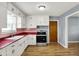 Well-lit kitchen with white cabinets, stainless steel appliances, and bright countertop at 333 E Waterbury Rd, Indianapolis, IN 46227