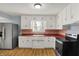 Charming kitchen featuring white cabinets and stainless steel appliances at 333 E Waterbury Rd, Indianapolis, IN 46227