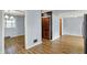 Open-concept living and dining room featuring hardwood flooring and multiple doorways at 333 E Waterbury Rd, Indianapolis, IN 46227
