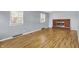 Bright living room with hardwood floors, fireplace, and natural light, offering a cozy atmosphere at 333 E Waterbury Rd, Indianapolis, IN 46227