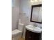 Charming bathroom with a dark wood vanity, modern sink, and a stylish mirror at 3516 Circle Blvd, Indianapolis, IN 46220