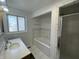 Bright bathroom featuring a soaking tub with tiled surround and a glass-enclosed shower for a spa-like experience at 3516 Circle Blvd, Indianapolis, IN 46220