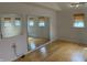 Bright bedroom with hardwood floors, natural light, and a mirrored wall at 3516 Circle Blvd, Indianapolis, IN 46220