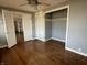 Bedroom with hardwood floors, a closet, and french doors at 3516 Circle Blvd, Indianapolis, IN 46220