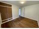Bedroom featuring hardwood floors and a built-in wooden wardrobe with drawers at 3516 Circle Blvd, Indianapolis, IN 46220