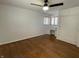 Bedroom features hardwood floors, a ceiling fan, and a built-in wardrobe with drawers at 3516 Circle Blvd, Indianapolis, IN 46220