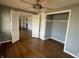 Bedroom with hardwood floors, a closet, and french doors at 3516 Circle Blvd, Indianapolis, IN 46220