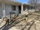 Charming home exterior with stone accents, flowerbed, and decorative bird bath at 3516 Circle Blvd, Indianapolis, IN 46220