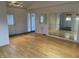 Bright living room with hardwood floors, a mirrored wall, and a light-filled, open layout at 3516 Circle Blvd, Indianapolis, IN 46220