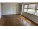 Sunlit living room showcasing hardwood floors, built-in shelves, and large windows at 3516 Circle Blvd, Indianapolis, IN 46220