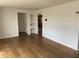 Cozy living room featuring hardwood floors, fresh paint, and access to the kitchen at 3516 Circle Blvd, Indianapolis, IN 46220