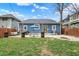 This backyard features a patio, picnic table, and fire pit, great for entertaining at 3535 Birchwood Ave, Indianapolis, IN 46205