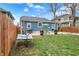 A relaxing hammock sits on the lawn in this fenced backyard at 3535 Birchwood Ave, Indianapolis, IN 46205