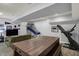 Finished basement with an entertainment area, a treadmill, and a table game with seating at 3535 Birchwood Ave, Indianapolis, IN 46205