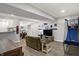 Bright basement with recreational space, including a sports game, a seating area, and bar for entertaining at 3535 Birchwood Ave, Indianapolis, IN 46205
