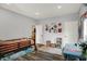 Bright bedroom with a bunk bed, desk, wood-look floors, and decor for a cheerful atmosphere at 3535 Birchwood Ave, Indianapolis, IN 46205