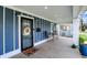 Cozy front porch with seating area, stylish lighting, and charming decorative touches at 3535 Birchwood Ave, Indianapolis, IN 46205