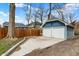 Spacious detached two-car garage with white doors and a paved driveway at 3535 Birchwood Ave, Indianapolis, IN 46205