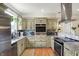 Well-appointed kitchen featuring stainless steel appliances, granite countertops, and stylish cabinetry at 3535 Birchwood Ave, Indianapolis, IN 46205