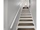 Stairway with wood treads and white risers at 3535 Birchwood Ave, Indianapolis, IN 46205