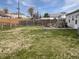 Large back yard with grass and wood fence at 3540 N Norfolk St, Indianapolis, IN 46224