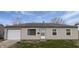 Charming ranch-style home with vinyl siding, attached garage, and well-maintained front lawn at 3540 N Norfolk St, Indianapolis, IN 46224